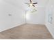 Spacious bedroom featuring a ceiling fan, and large windows for natural light, and modern flooring at 11709 N Armenia Ave, Tampa, FL 33612