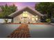 Charming home with a well-manicured lawn, brick path and delightful architectural details at 11709 N Armenia Ave, Tampa, FL 33612