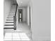 Bright hallway with staircase, marble floors, and arched doorways that create flow at 11709 N Armenia Ave, Tampa, FL 33612