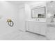 Bright laundry room with washer/dryer hookups and a large mirror at 11709 N Armenia Ave, Tampa, FL 33612