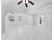 Bright, open living room with marble floors, ceiling fan, and arched doorways at 11709 N Armenia Ave, Tampa, FL 33612
