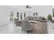 Elegant living area with modern furniture, tile floors, and French doors to the pool at 11709 N Armenia Ave, Tampa, FL 33612
