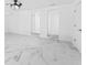 Bright living room with sleek marble floors and arched doorways at 11709 N Armenia Ave, Tampa, FL 33612