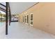 Covered patio with tile floors and access to the backyard at 11709 N Armenia Ave, Tampa, FL 33612