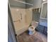 Tiled bathroom featuring a white toilet, shower and bathtub ready for remodeling at 1234 11Th Se Cir, Largo, FL 33771