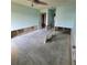 Bare bedroom with exposed wall studs and plumbing; ceiling fan and door visible at 1234 11Th Se Cir, Largo, FL 33771