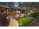 Charming single-story home with small front yard, plants, and patio furniture at sunset at 1234 11Th Se Cir, Largo, FL 33771