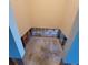 Narrow hallway with exposed brick ready for remodeling and design inspiration at 1234 11Th Se Cir, Largo, FL 33771