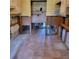Tiled kitchen area ready for renovation, featuring upper cabinets and exposed plumbing at 1234 11Th Se Cir, Largo, FL 33771