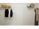 Organized closet space with wire shelving, hanging rods, and storage for clothing and personal items at 13167 Violet Flame Ave, Wimauma, FL 33598