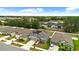 An aerial view of the two-story home with a two-car garage, solar panels and fenced backyard at 13380 Great Plains Dr, Riverview, FL 33579