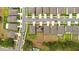Birds eye view of the home, highlighting the backyard, solar panels and surrounding neighborhood at 13380 Great Plains Dr, Riverview, FL 33579