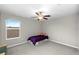 Serene bedroom featuring a ceiling fan, large window for natural light, and ample space for relaxation and rest at 13380 Great Plains Dr, Riverview, FL 33579