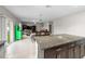 Open-concept kitchen flows into dining area and Gathering room, stainless appliances, and natural light at 13380 Great Plains Dr, Riverview, FL 33579