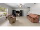 Inviting living room with neutral tones, tile flooring, and comfortable seating for relaxation and entertainment at 13380 Great Plains Dr, Riverview, FL 33579
