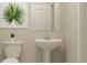 A bright bathroom featuring a modern sink, toilet, and elegant decor at 13515 White Gold Run, Parrish, FL 34219