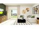 Bright living room featuring a comfortable white sofa, modern decor, and stylish furnishings at 13515 White Gold Run, Parrish, FL 34219