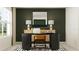 A comfortable home office with a stylish desk, modern lamps and accent wall at 13515 White Gold Run, Parrish, FL 34219