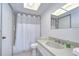 Bright bathroom with a shower and bathtub, toilet and sink with large counter at 13602 S Village Dr # 1309, Tampa, FL 33618