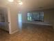 Spacious living room with tiled floors and large windows, offering bright, natural light at 1466 Byram Dr, Clearwater, FL 33755