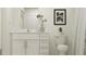 Bright bathroom featuring a white vanity with a quartz countertop and sleek hardware at 15250 Rainbow Quartz St, Wimauma, FL 33598