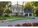 Charming two-story home with a manicured lawn, a welcoming front porch, and a spacious two-car garage at 15704 Mifflin Ct, Tampa, FL 33647