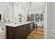 Stylish kitchen island with bar seating, modern appliances, and custom cabinets at 15704 Mifflin Ct, Tampa, FL 33647
