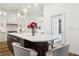 Open kitchen with granite counters, modern appliances, and a large center island at 15704 Mifflin Ct, Tampa, FL 33647