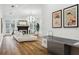 Bright living room with a fireplace and large windows providing ample natural light, complemented by modern decor at 15704 Mifflin Ct, Tampa, FL 33647