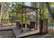 Relaxing outdoor seating area with pergola and chairs overlooking the waterfront at 15704 Mifflin Ct, Tampa, FL 33647