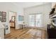 Bright playroom with natural light, featuring a charming swing and wood floors for a playful ambiance at 15704 Mifflin Ct, Tampa, FL 33647