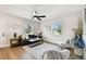 Spacious living room featuring neutral colors, wood-look floors, modern decor, and ample natural light at 1607 34Th E Ave, Bradenton, FL 34208