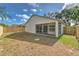 Exterior view of the home shows a fenced backyard with a screened patio offering a private outdoor space at 1639 Wakefield Dr, Brandon, FL 33511