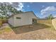 This exterior shot shows the spacious backyard with a new wooden fence surrounding the property at 1639 Wakefield Dr, Brandon, FL 33511