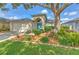 Charming single-story home featuring a well-manicured lawn and lush landscaping at 1639 Wakefield Dr, Brandon, FL 33511