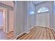 Bright foyer with high ceilings, wood floors, and a large arched window above the front door at 1639 Wakefield Dr, Brandon, FL 33511