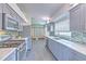 Modern kitchen features gray cabinetry, stainless steel appliances, and a tile backsplash at 1639 Wakefield Dr, Brandon, FL 33511