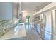 Modern kitchen showcasing gray cabinetry, quartz countertops, and stainless steel appliances at 1639 Wakefield Dr, Brandon, FL 33511