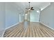 Spacious living room with sleek wood floors and neutral-colored walls at 1639 Wakefield Dr, Brandon, FL 33511