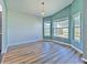 Bright living room featuring hardwood floors and large windows, creating a warm and inviting space at 1639 Wakefield Dr, Brandon, FL 33511