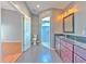 Ensuite bath boasts granite counters, glass shower, and tile floors for a modern and sleek design at 1639 Wakefield Dr, Brandon, FL 33511