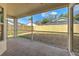 Screened patio features tile flooring, views of the backyard, and provides an enjoyable outdoor living space at 1639 Wakefield Dr, Brandon, FL 33511