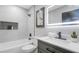 Stylish bathroom with tub and shower, modern vanity, lighted mirror, and decorative niche with tile surround at 1715 N Alexander Rd, Tampa, FL 33603