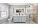 Beautiful bathroom featuring a double sink vanity and glass enclosed shower at 1715 N Alexander Rd, Tampa, FL 33603