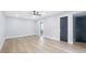 Bright bedroom with hardwood floors and adjacent bath at 1715 N Alexander Rd, Tampa, FL 33603