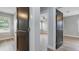 Bedroom showcasing wood-look flooring, neutral walls and contrasting trim and doors at 1715 N Alexander Rd, Tampa, FL 33603
