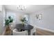 Stylish dining room showcasing modern decor, ample natural light, and elegant table setting at 1715 N Alexander Rd, Tampa, FL 33603