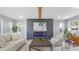 Bright living room with modern electric fireplace and inviting layout at 1715 N Alexander Rd, Tampa, FL 33603