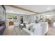Open-concept living room with beam and breakfast bar seating at 1715 N Alexander Rd, Tampa, FL 33603
