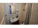 Cozy bathroom featuring a single sink and walk in shower at 1755 Sunset Point Rd, Clearwater, FL 33755